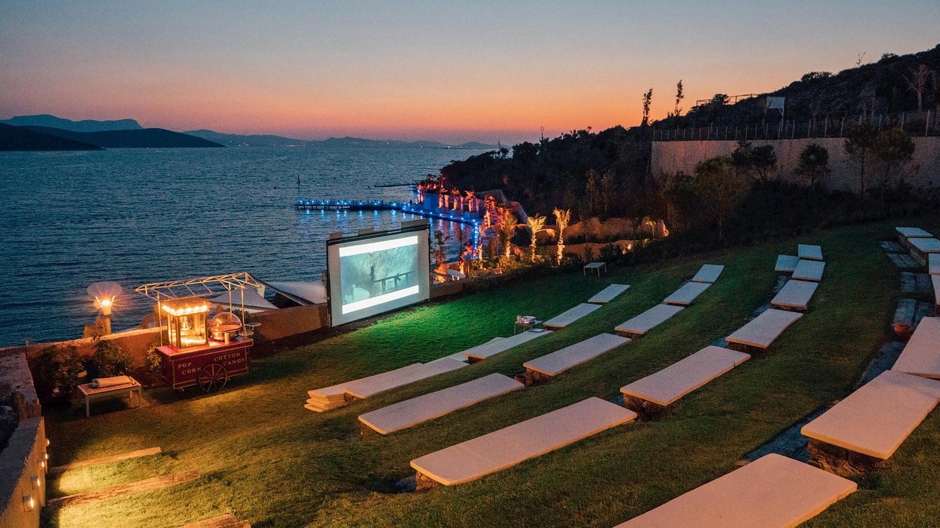 Outdoor cinema setup near the water